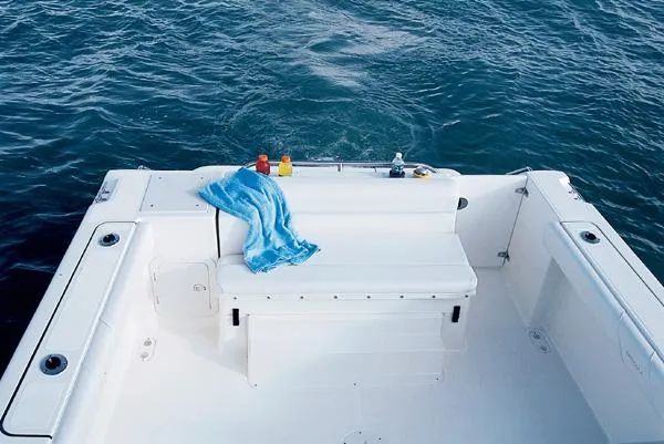 Slide: The Image of 2003 Pursuit 2865 Denali boat interior with compact sink and storage compartments. - 10