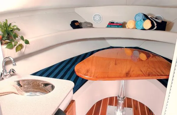 Slide: The Image of 2003 Pursuit 2865 Denali boat cockpit with steering wheel and control panel. - 12