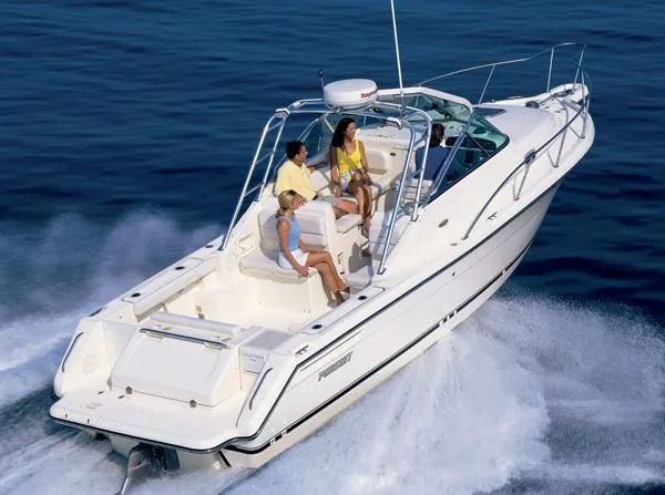 Slide: The Image of 2003 Pursuit 2865 Denali boat with covered cockpit in storage facility. - 6