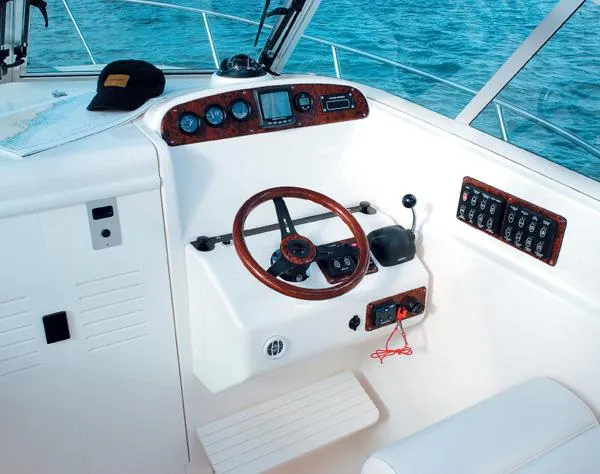 Slide: The Image of Interior of 2003 Pursuit 2865 Denali boat, featuring seating and storage compartments. - 9