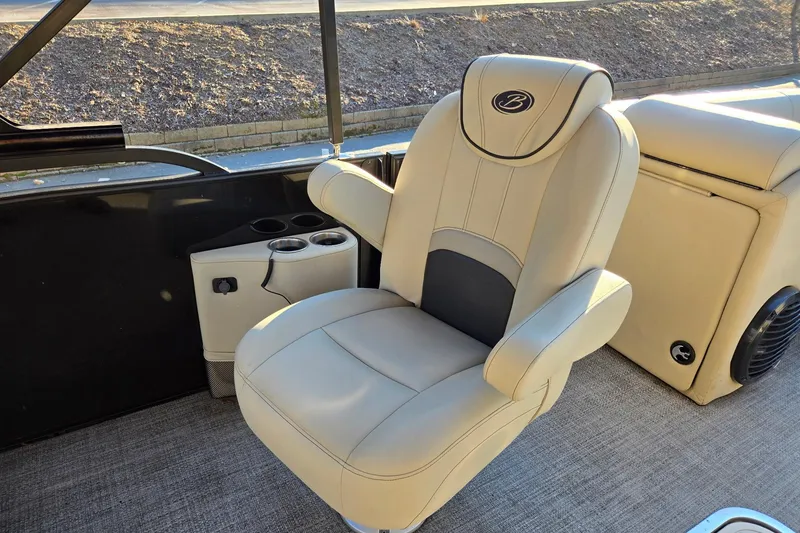 Slide: The Image of Luxurious seating on 2020 Barletta C22UC pontoon boat with cup holders and armrests. - 12