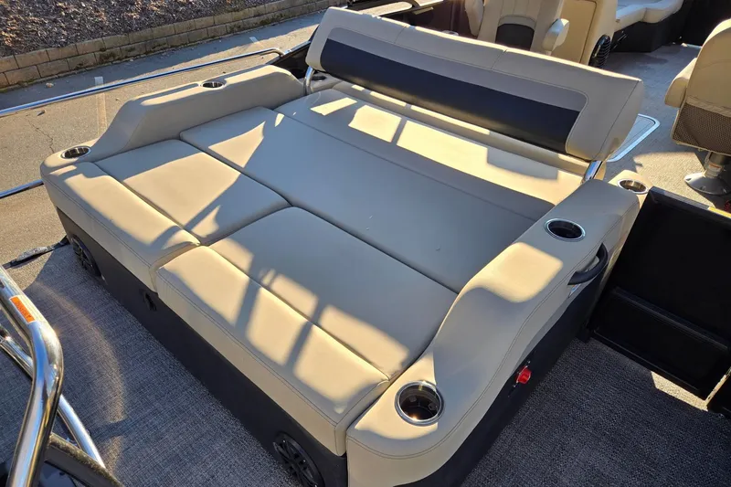 Slide: The Image of 2020 Barletta C22UC boat interior with beige seating and cup holders. - 16