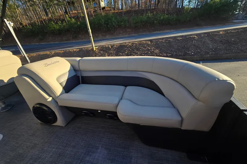 Slide: The Image of 2020 Barletta C22UC boat interior with beige seating and speaker system. - 17