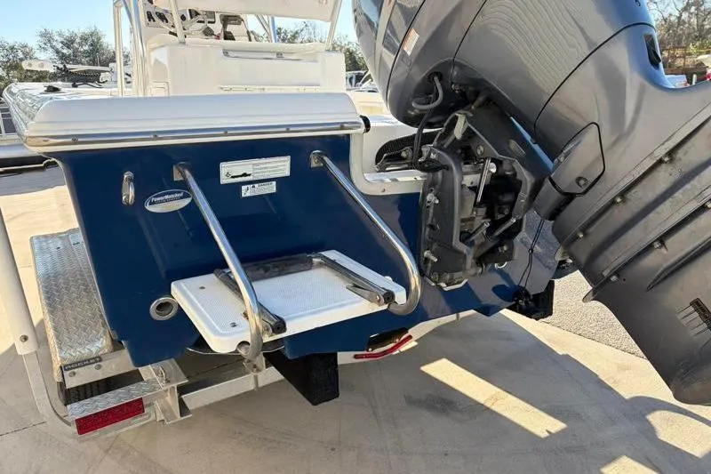 Slide: The Image of 2011 Sea Hunt BX 22 BR boat with outboard motor and swim platform. - 11