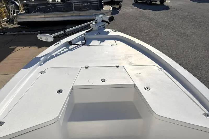 Slide: The Image of 2011 Sea Hunt BX 22 BR boat deck with mounted equipment, docked outdoors. - 16