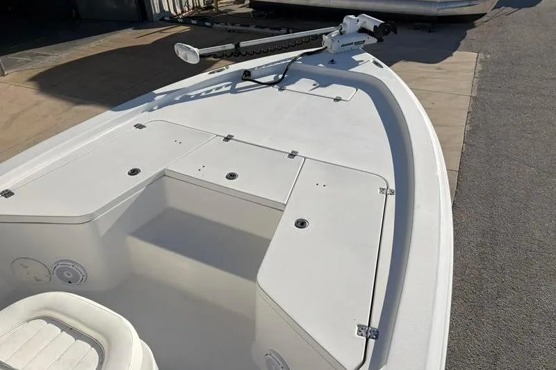 Slide: The Image of 2011 Sea Hunt BX 22 BR boat deck with storage compartments and trolling motor. - 17