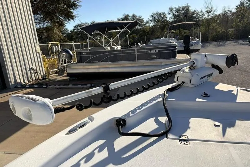 Slide: The Image of 2011 Sea Hunt BX 22 BR boat with trolling motor in marina setting. - 18