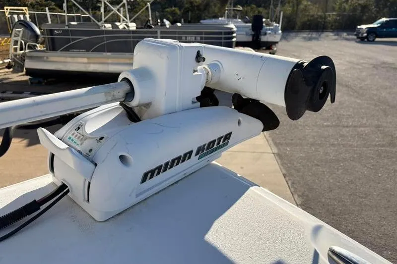 Slide: The Image of Minn Kota trolling motor on 2011 Sea Hunt BX 22 BR boat, docked outdoors. - 19
