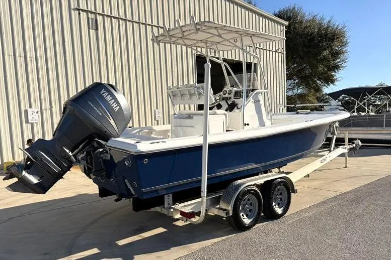 Slide: The Image of 2011 Sea Hunt BX 22 BR boat on trailer with Yamaha outboard motor. - 2