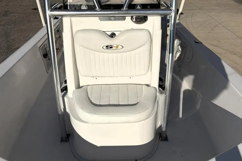 Slide: The Image of 2011 Sea Hunt BX 22 BR boat interior with white seating and metal frame. - 21