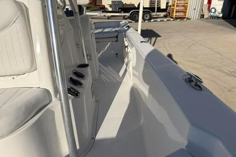 Slide: The Image of 2011 Sea Hunt BX 22 BR boat interior with seating and rod holders. - 24