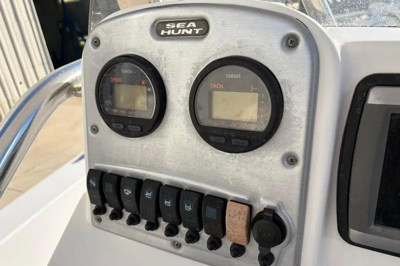 Slide: The Image of 2011 Sea Hunt BX 22 BR dashboard with Yamaha speed and tach gauges. - 27