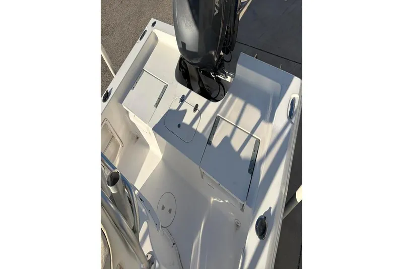 Slide: The Image of 2011 Sea Hunt BX 22 BR boat deck with storage compartments and motor. - 31