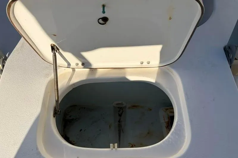 Slide: The Image of Open storage compartment on 2011 Sea Hunt BX 22 BR boat. - 33