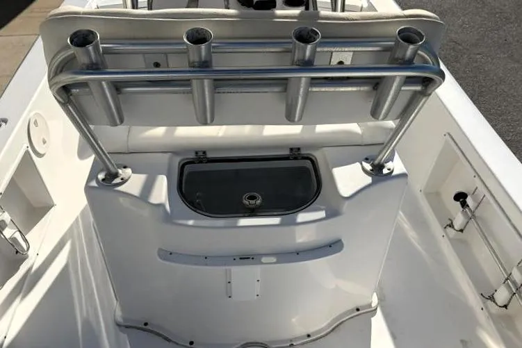 Slide: The Image of 2011 Sea Hunt BX 22 BR boat interior with rod holders and storage compartment. - 34