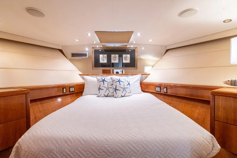 Slide: The Image of Luxurious bedroom interior of 2000 Hatteras 75 Sport Deck Motor Yacht with elegant wood finishes. - 61