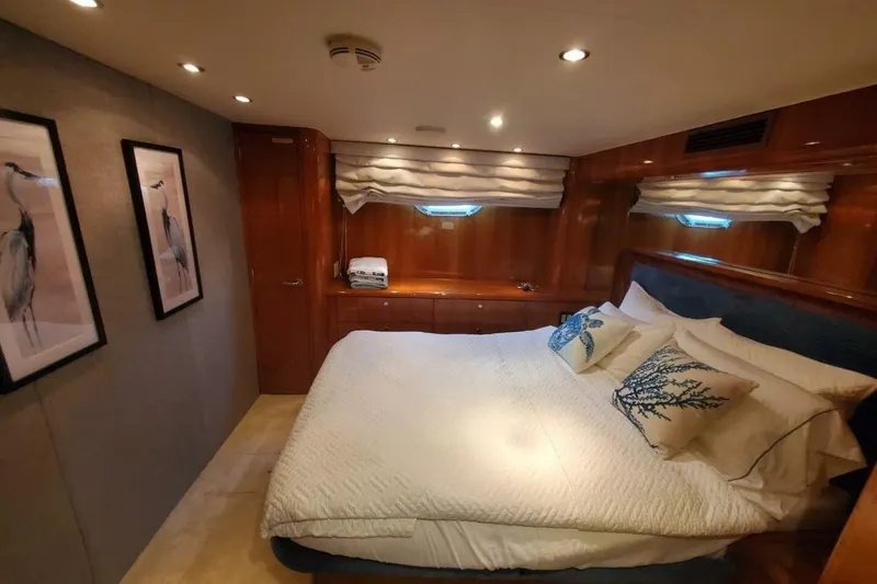 Slide: The Image of Luxurious bedroom interior of 2000 Hatteras 75 Sport Deck Motor Yacht with elegant decor. - 12