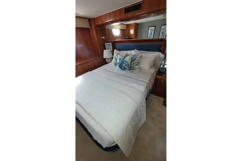 Slide: The Image of Luxurious bedroom interior of 2000 Hatteras 75 Sport Deck Motor Yacht. - 13