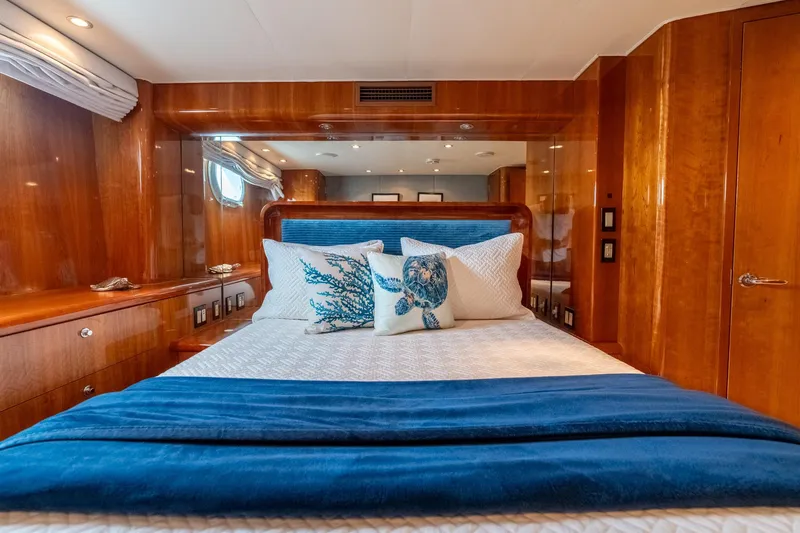 Slide: The Image of Luxurious bedroom interior of 2000 Hatteras 75 Sport Deck Motor Yacht with elegant wood finish. - 58