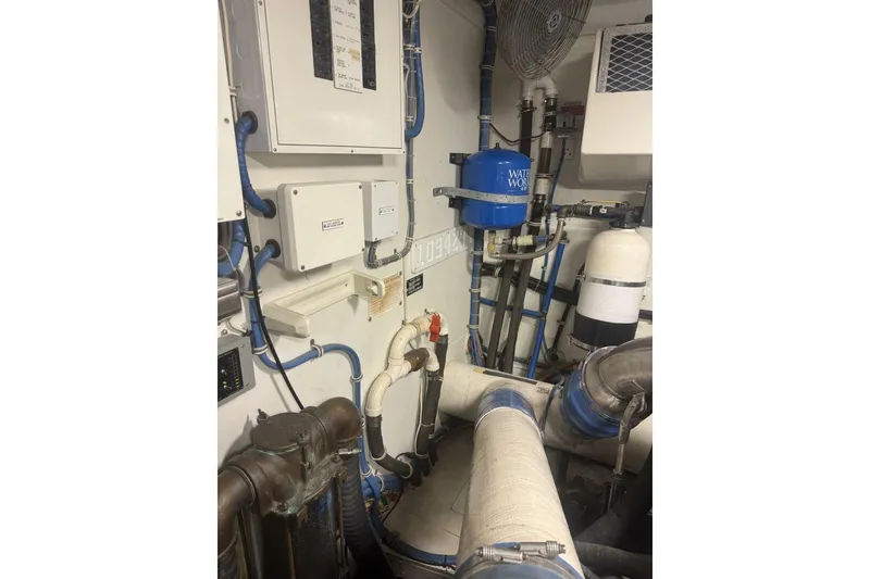 Slide: The Image of Engine room of 2000 Hatteras 75 Sport Deck Motor Yacht with pipes and equipment. - 21