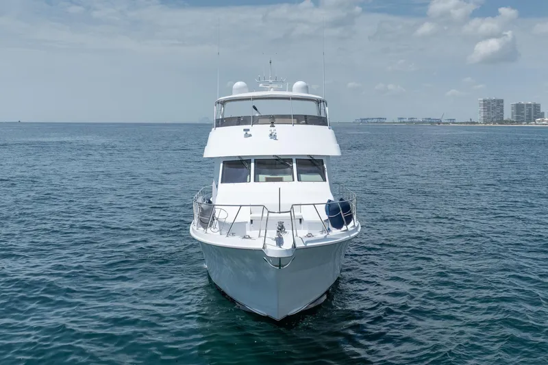 Slide: The Image of Front view of a 2000 Hatteras 75 Sport Deck Motor Yacht on open water. - 3