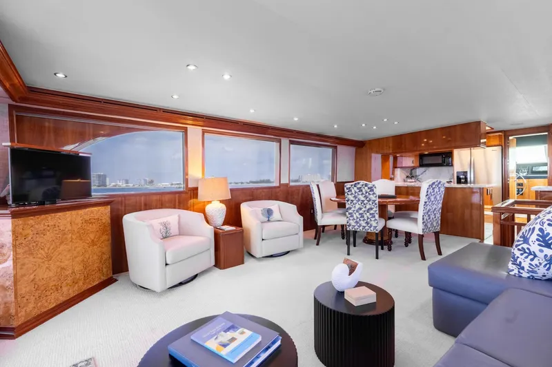 Slide: The Image of Luxurious interior of 2000 Hatteras 75 Sport Deck Motor Yacht with elegant seating and dining area. - 45