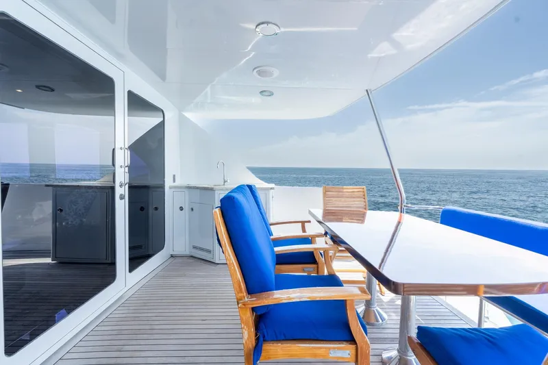 Slide: The Image of Luxurious deck of 2000 Hatteras 75 Sport Deck Motor Yacht with ocean view. - 23
