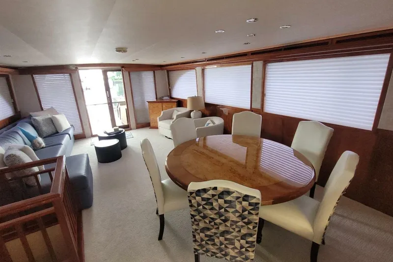 Slide: The Image of Luxurious interior of 2000 Hatteras 75 Sport Deck Motor Yacht with elegant dining area. - 3