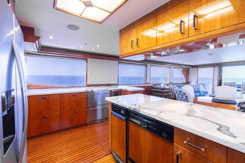 Slide: The Image of Luxurious kitchen interior of 2000 Hatteras 75 Sport Deck Motor Yacht with ocean view. - 41