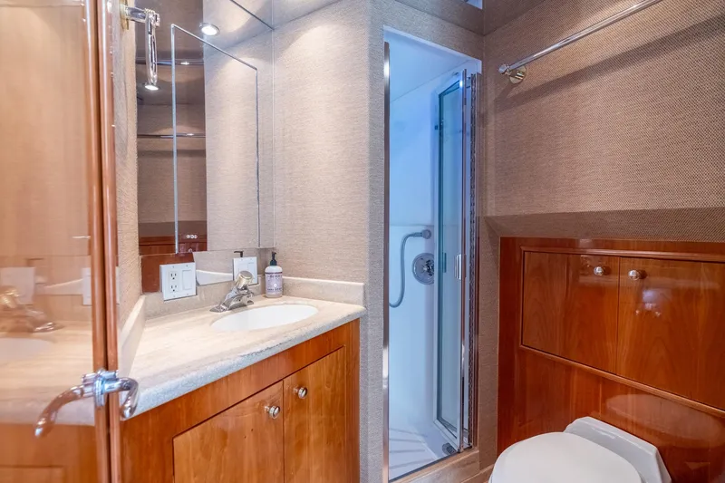 Slide: The Image of Luxurious bathroom on 2000 Hatteras 75 Sport Deck Motor Yacht with shower and vanity. - 65