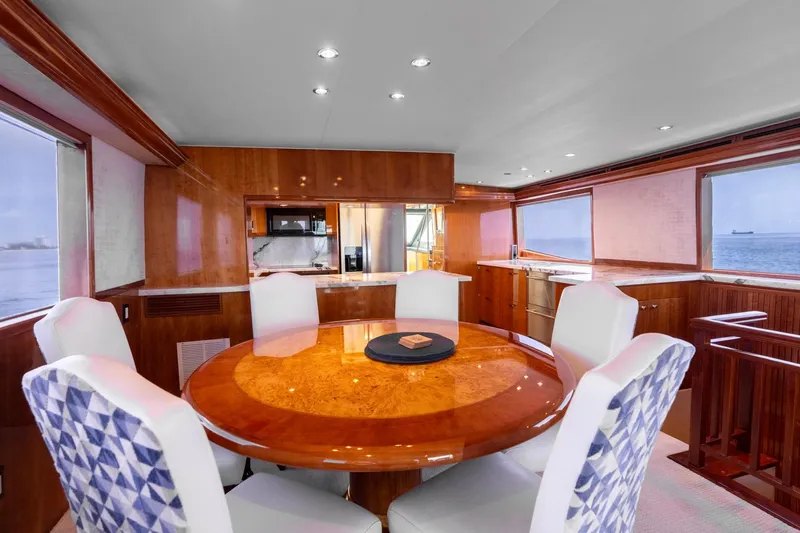 Slide: The Image of Luxurious dining area on 2000 Hatteras 75 Sport Deck Motor Yacht with ocean views. - 44