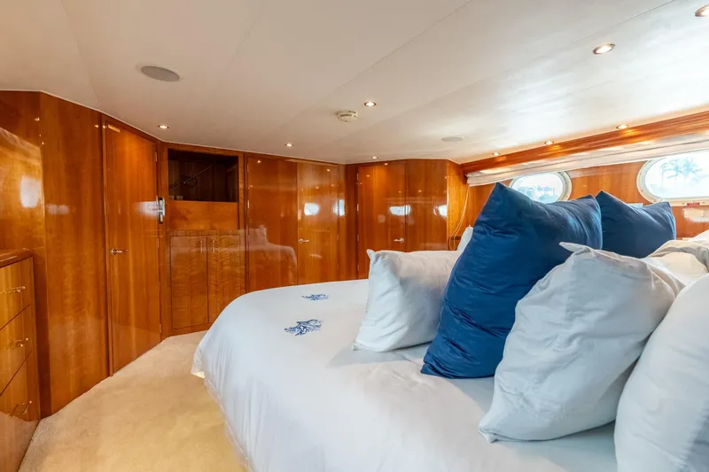 Slide: The Image of Luxurious bedroom interior of 2000 Hatteras 75 Sport Deck Motor Yacht with plush pillows. - 51