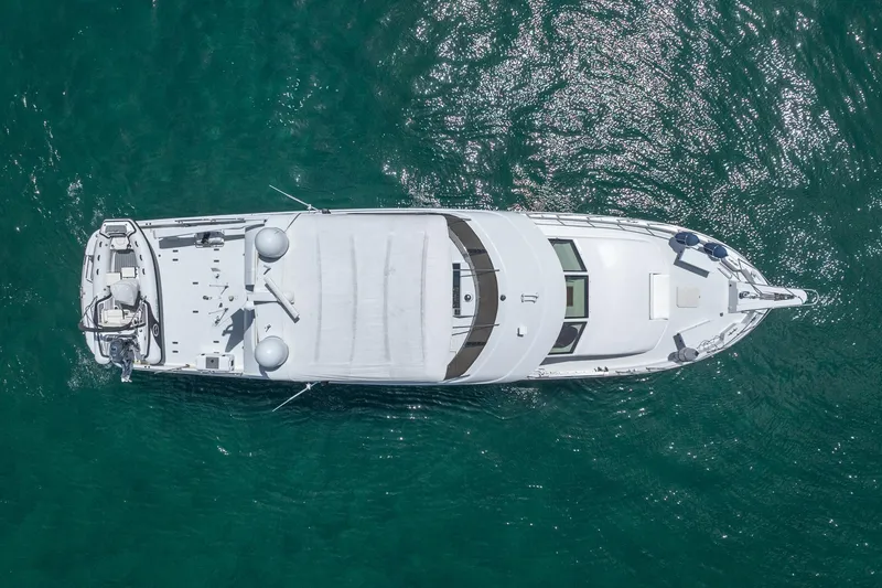 Slide: The Image of Aerial view of 2000 Hatteras 75 Sport Deck Motor Yacht on clear blue water. - 8