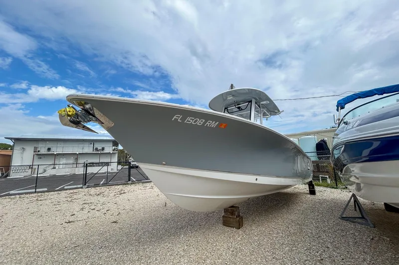 Slide: The Image of 2018 Sea Hunt Gamefish 27 boat on display under a cloudy sky. - 3