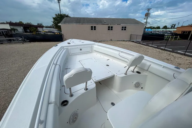 Slide: The Image of 2018 Sea Hunt Gamefish 27 boat interior with seating and storage compartments. - 7