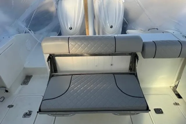 Slide: The Image of 2023 Pursuit DC 295 Dual Console boat interior with foldable seating. - 31