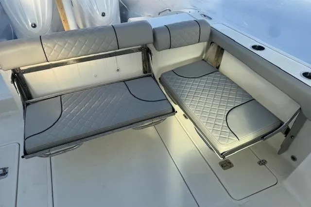 Slide: The Image of 2023 Pursuit DC 295 Dual Console boat seating with quilted gray upholstery. - 32