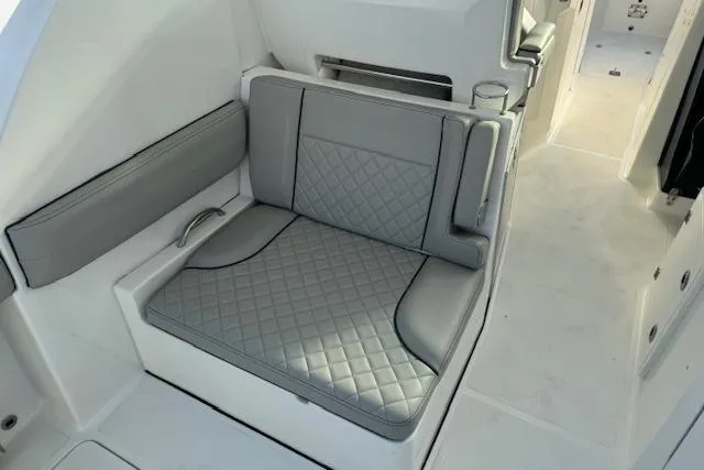 Slide: The Image of 2023 Pursuit DC 295 Dual Console boat with luxurious gray seating and quilted design. - 33