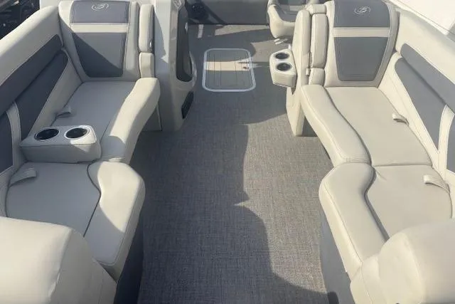 Slide: The Image of 2023 Barletta C22UC pontoon boat interior with plush seating and cup holders. - 3