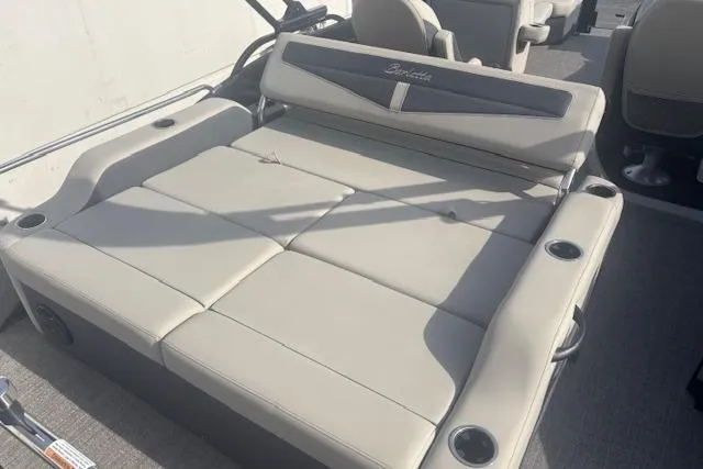 Slide: The Image of 2023 Barletta C22UC boat interior with spacious seating and cup holders. - 7