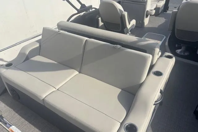Slide: The Image of 2023 Barletta C22UC boat interior with beige seating and cup holders. - 8