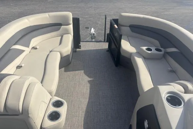 Slide: The Image of 2023 Barletta C22UC pontoon boat interior with plush seating and cup holders. - 9