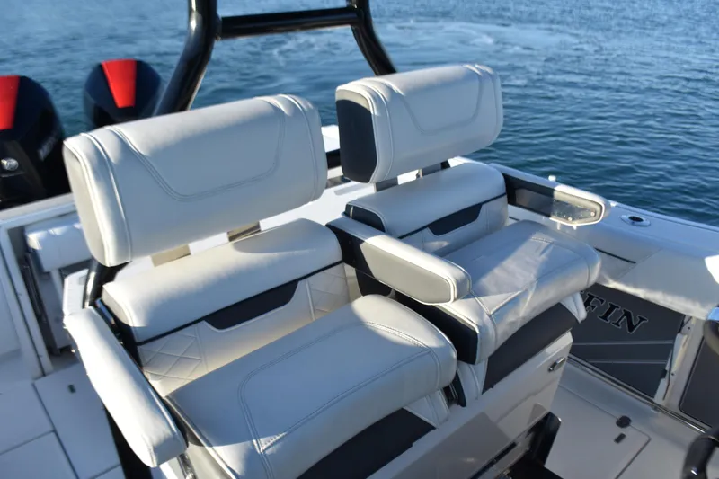 Slide: The Image of 2022 Blackfin 272 CC boat with luxurious white seating on the water. - 20