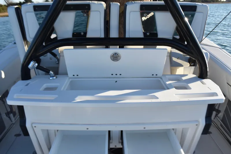 Slide: The Image of 2022 Blackfin 272 CC boat interior with fishing station and storage compartments. - 23