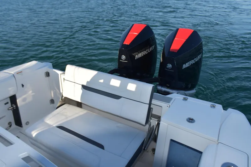 Slide: The Image of 2022 Blackfin 272 CC boat with dual Mercury engines on water. - 28