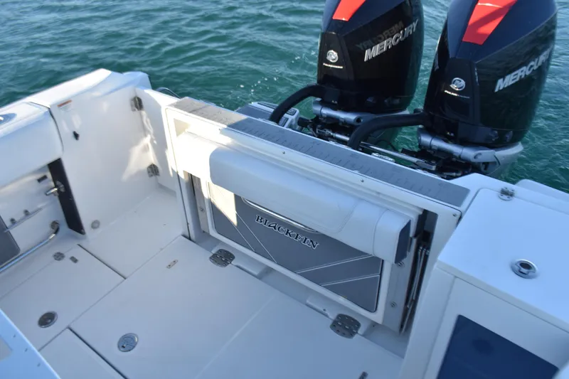 Slide: The Image of 2022 Blackfin 272 CC boat with dual Mercury engines on the water. - 29