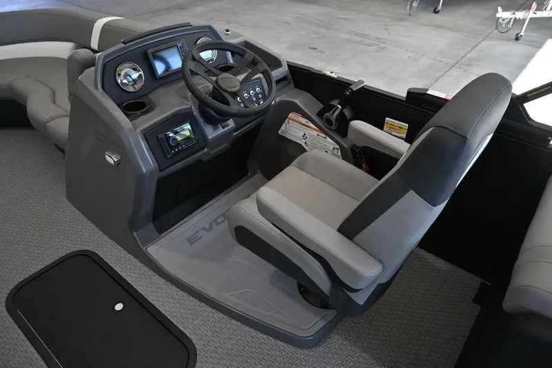 Slide: The Image of Interior of 2026 Evotti 521QL boat, featuring modern helm and comfortable seating. - 12