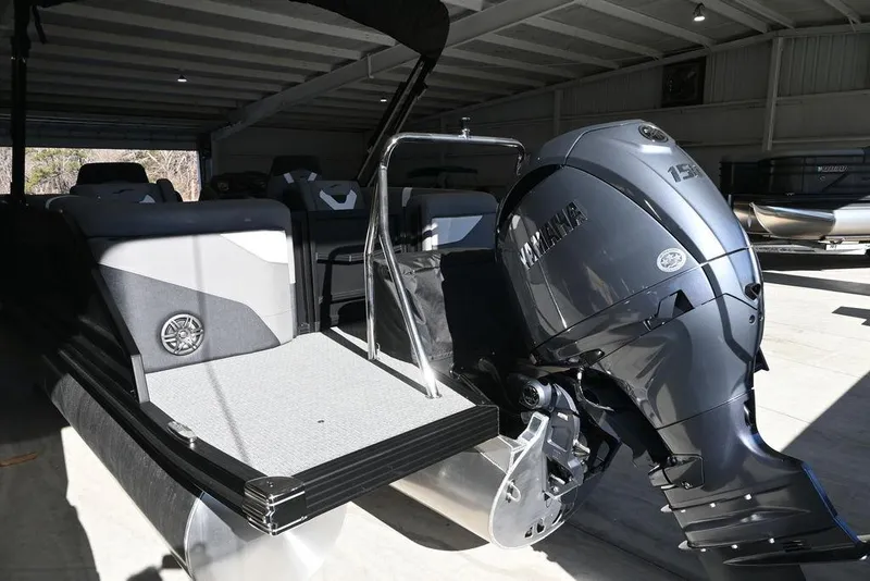 Slide: The Image of 2026 Evotti 521QL boat with Yamaha outboard motor in a garage setting. - 5
