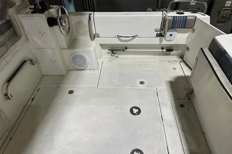 Slide: The Image of 2017 Cutwater C-302 Coupe boat interior with steering wheel and seating area. - 16