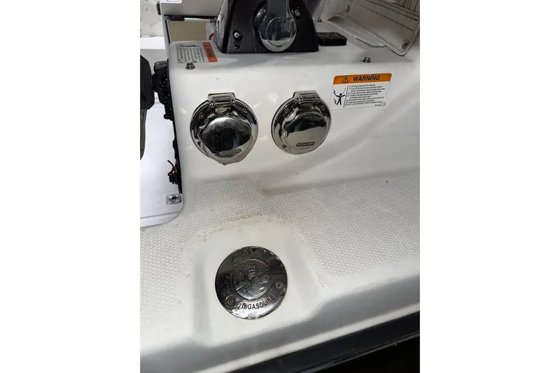 Slide: The Image of 2017 Cutwater C-302 Coupe boat fuel and water fill ports with warning label. - 17